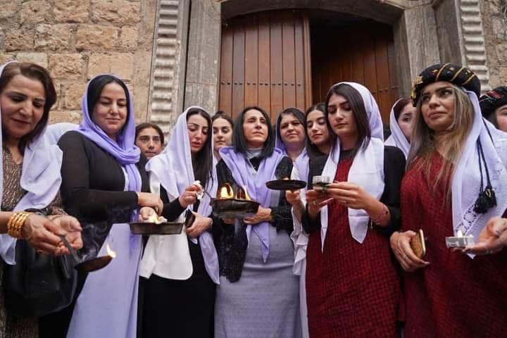 Iraqi Yazidis gather outside the Temple of Lalish in a valley near the Kurdish city of Dohuk on April 19, 2022, during a ceremony marking the Yazidi New Year. - The Yazidis, who number about 1.6 million, commemorate the arrival of light into the world during the new year celebrations. (Photo by Ismael ADNAN / AFP) (Photo by ISMAEL ADNAN/AFP via Getty Images)